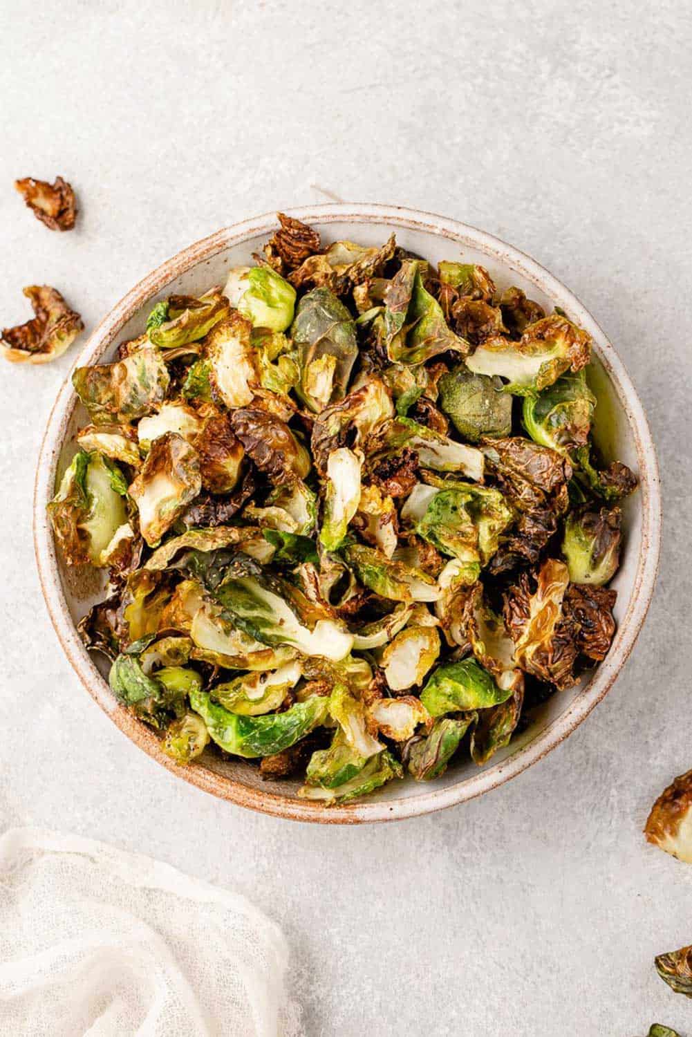 air fried brussels sprout chips on a plate