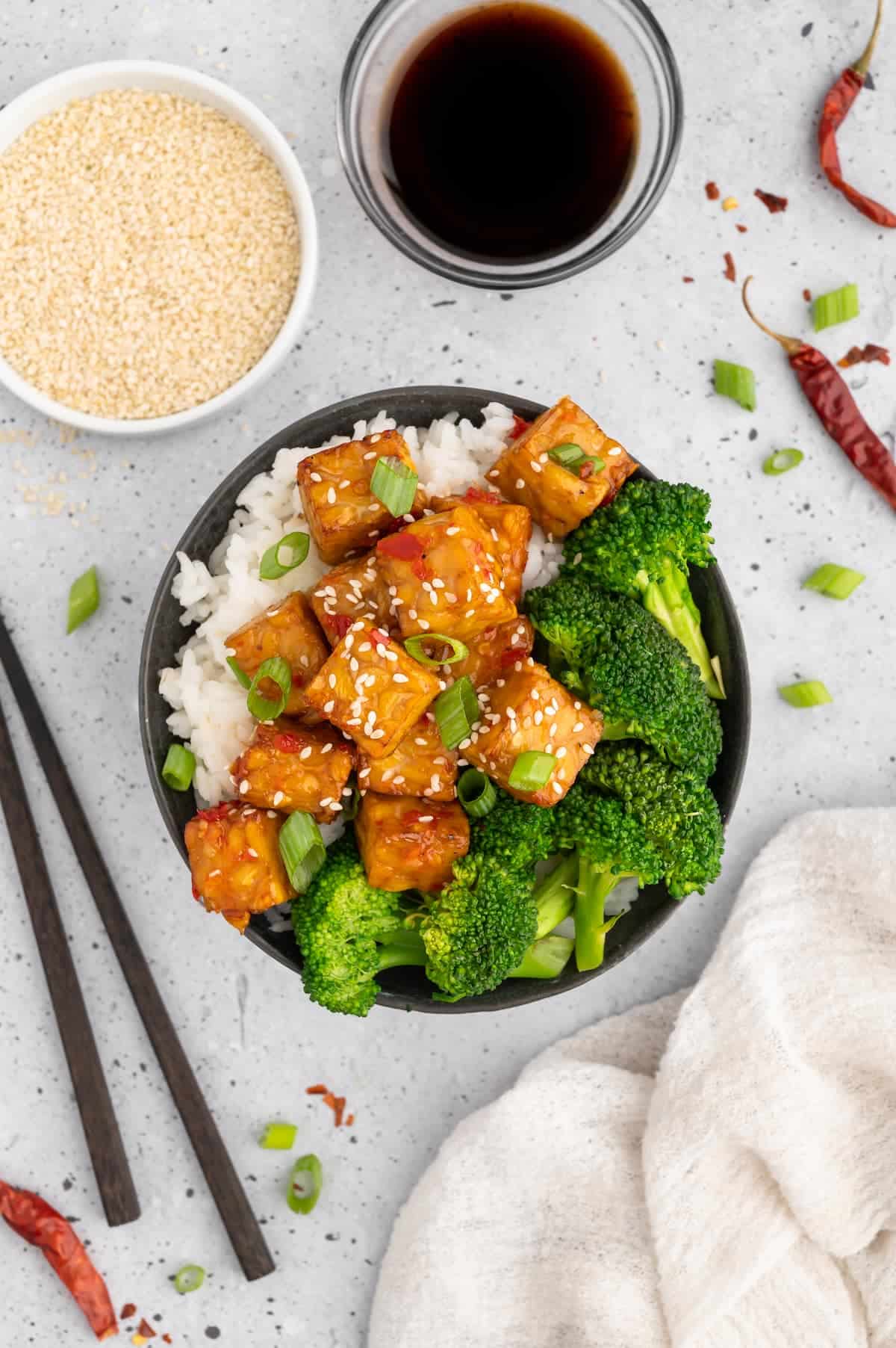 A bowl of air-fryer tempeh with broccoli and rice.