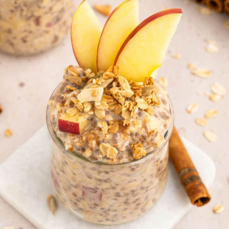 Apple pie overnight oats with a cinnamon stick.