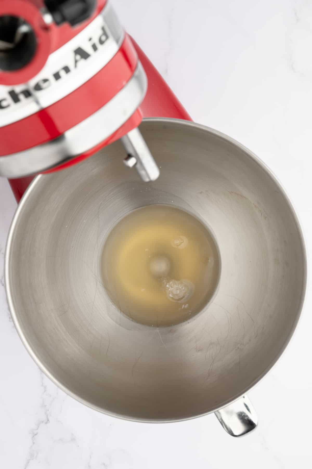 Aquafaba in a stand mixer bowl.