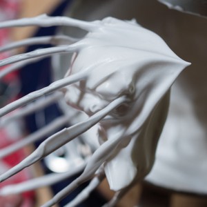 Aquafaba whipped cream on the stand mixer whisk.