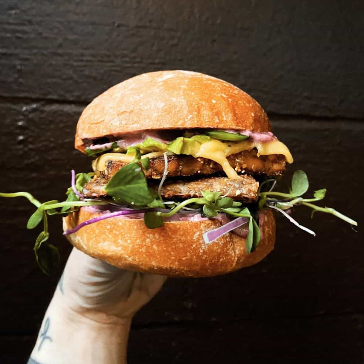 A spicy vegan tempeh sandwich from The Bye and Bye in Portland.