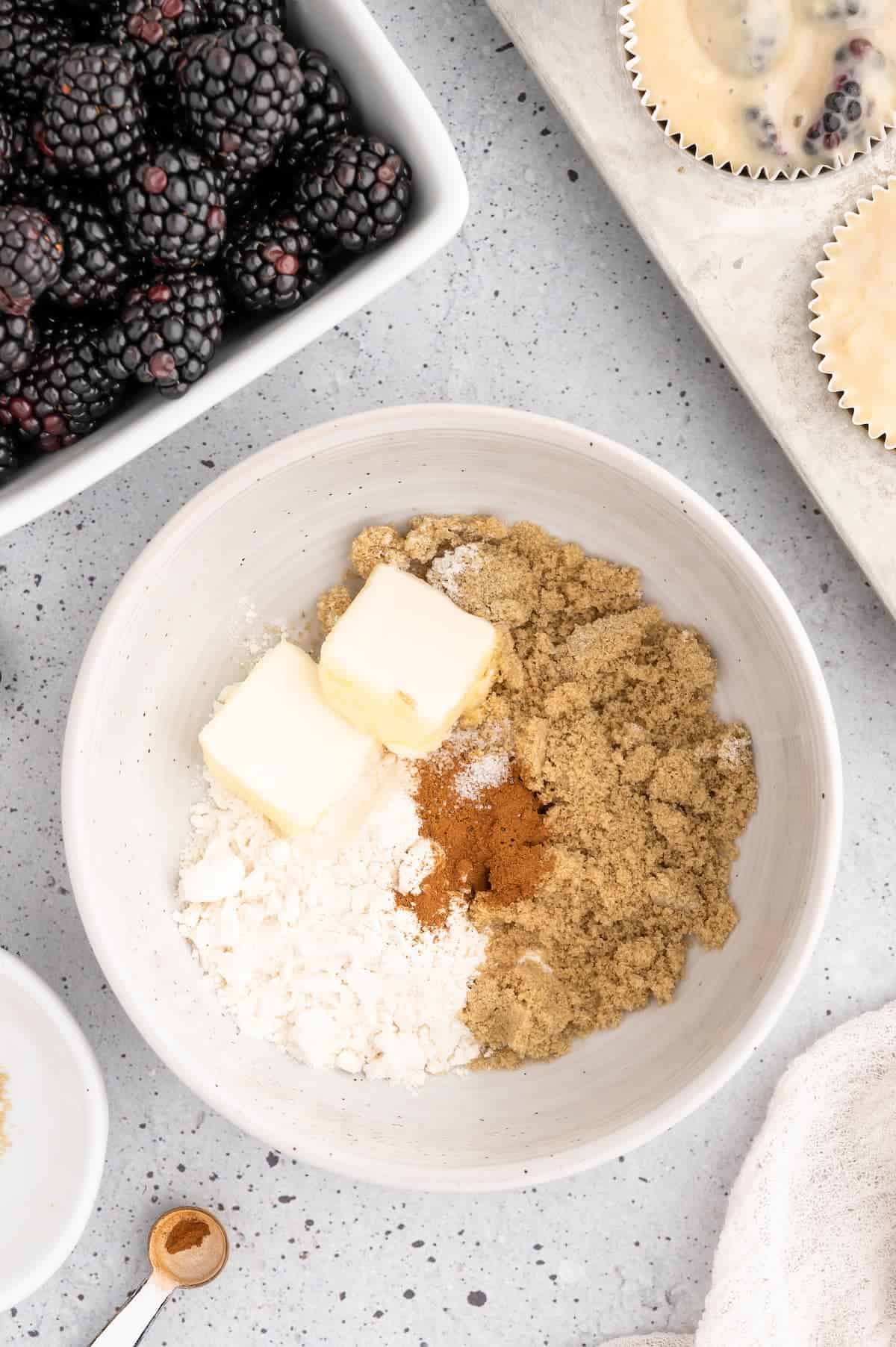 Crumb topping ingredients for blackberry muffins in a bowl.