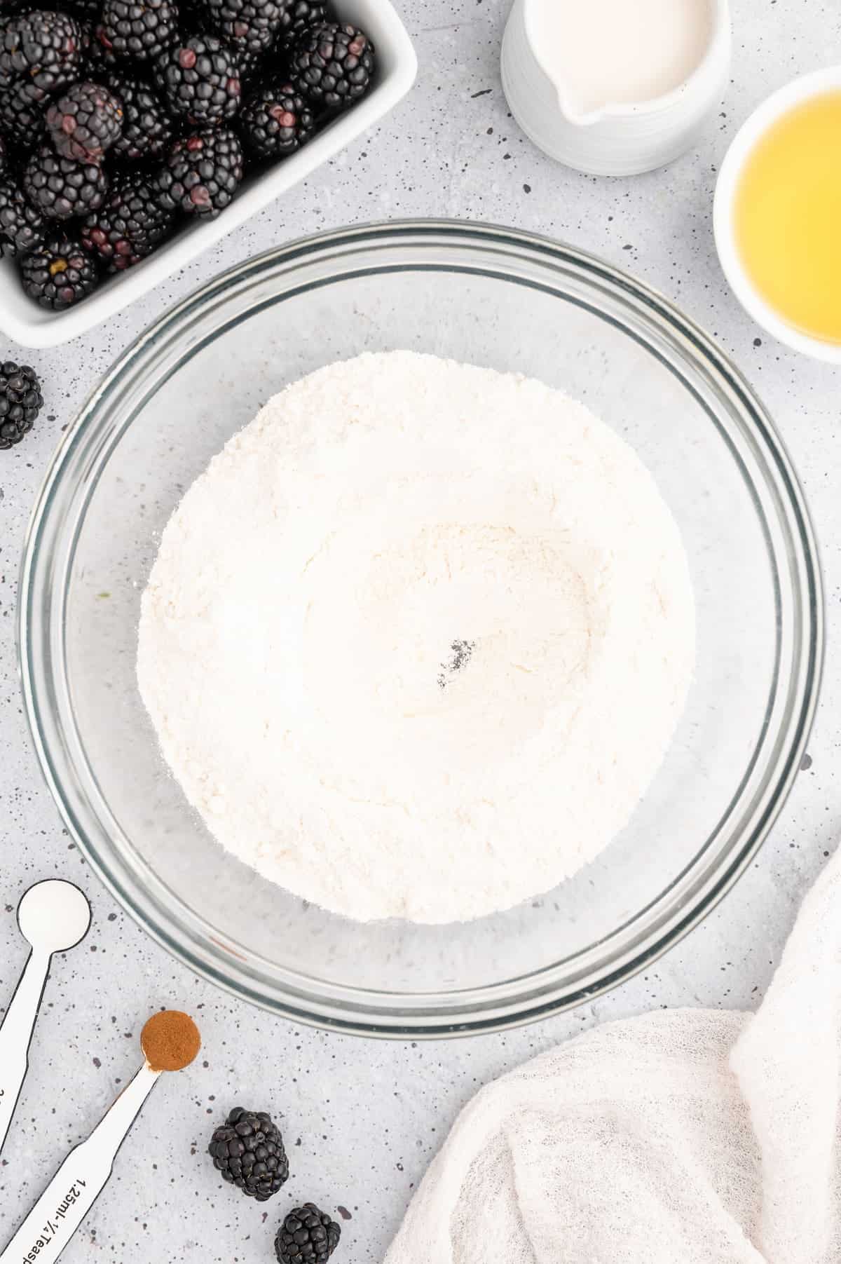 Dry ingredients for vegan blackberry muffins in a bowl.