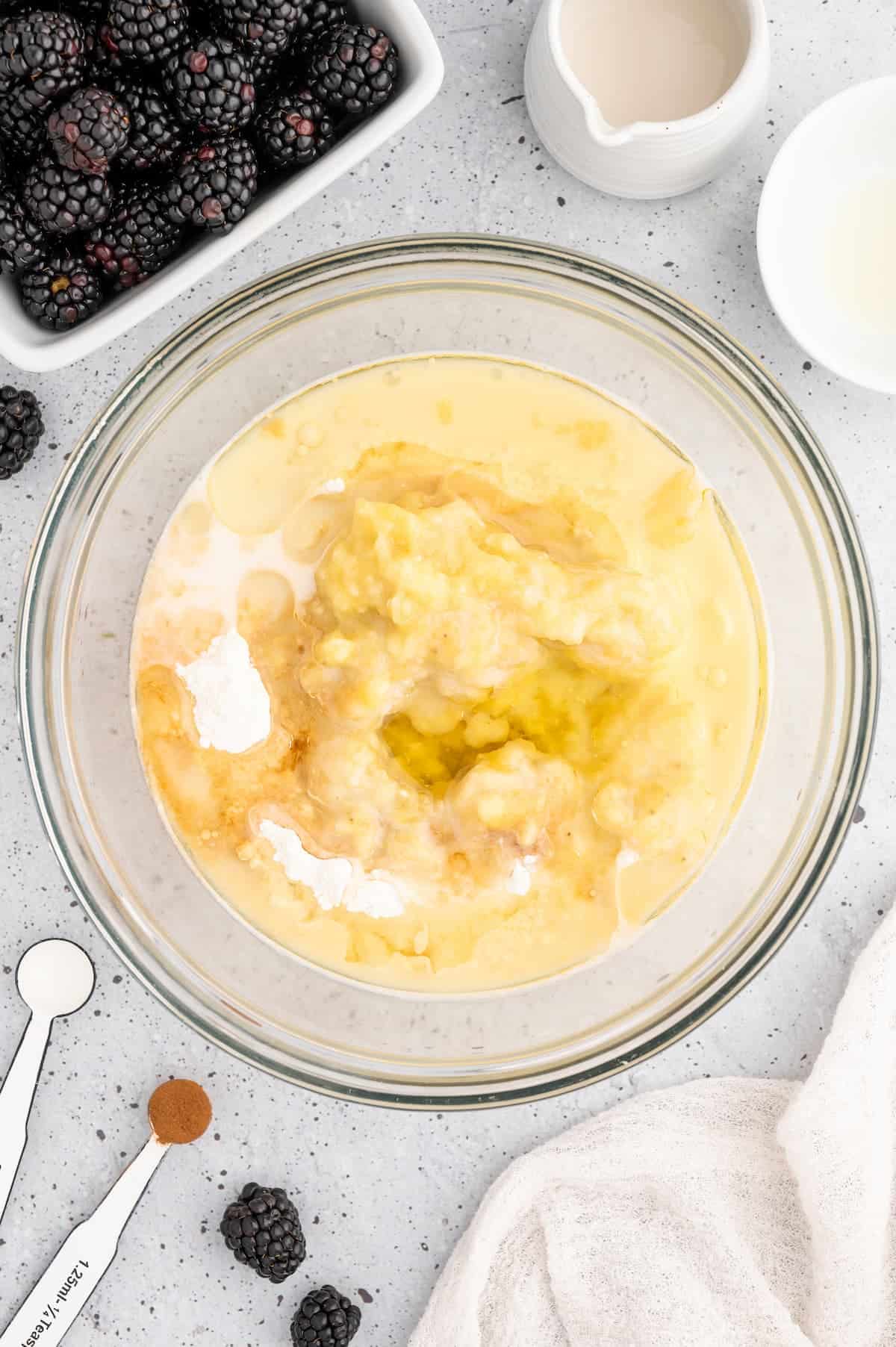 Batter for vegan blackberry muffins in a bowl.