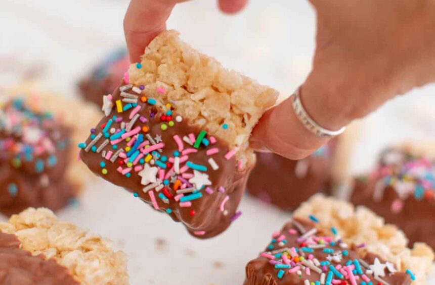 batch of chocolate covered rice krispies treats with sprinkles