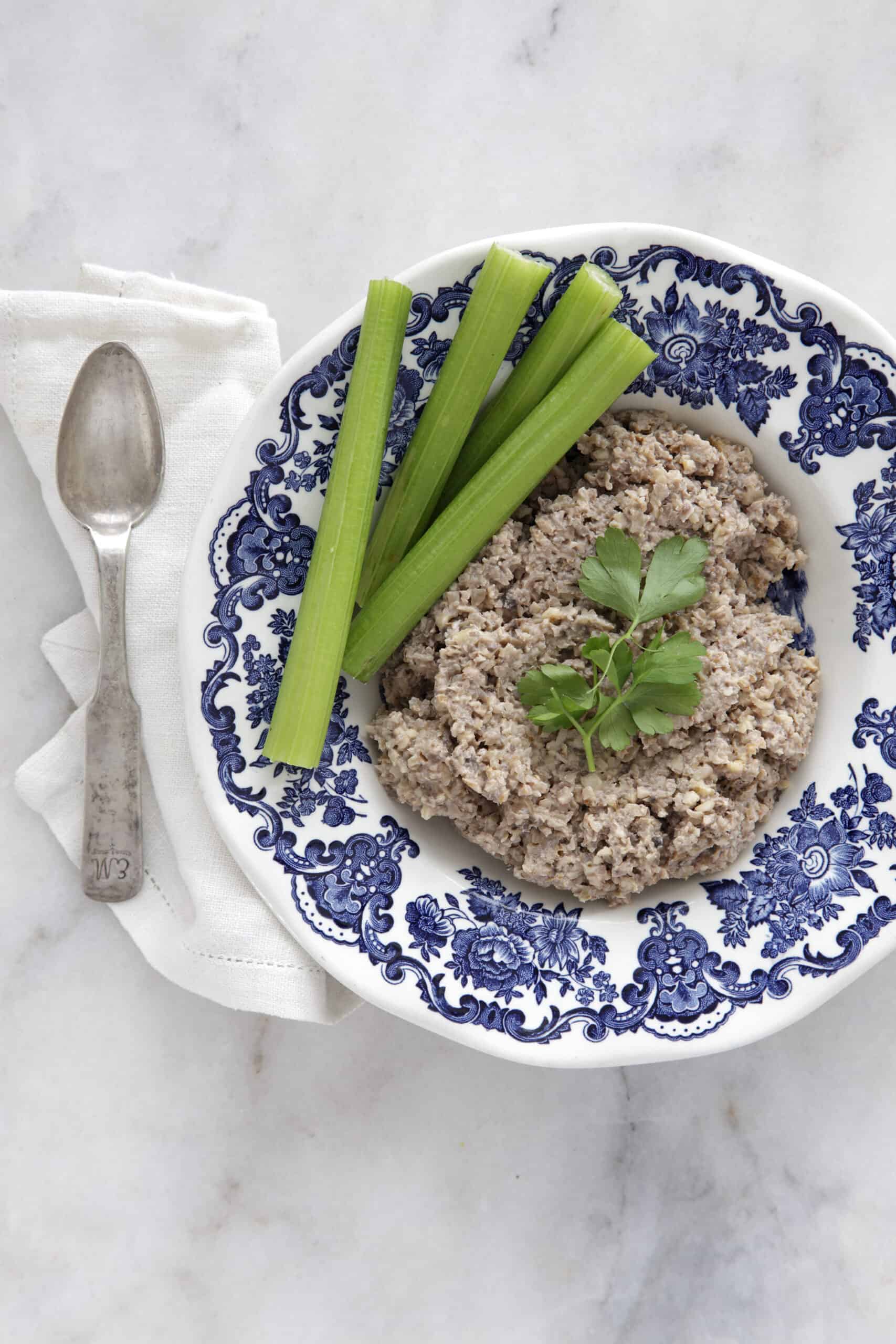 Vegan chopped liver in a Passover plate garnished with celery. 