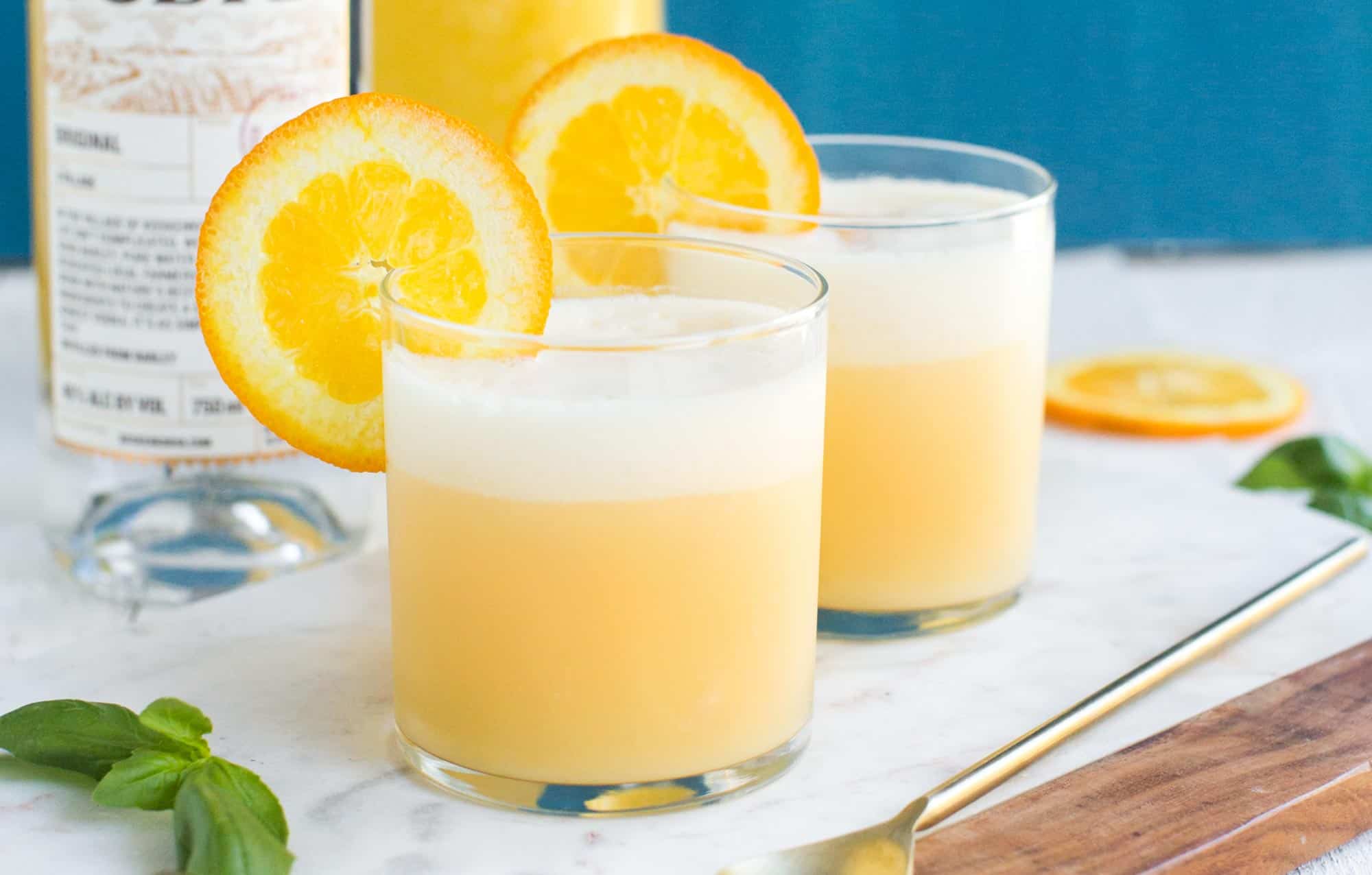 Dairy Free Orange Creamsicle Cocktails with Coconut Milk Garnished with an Orange Slice