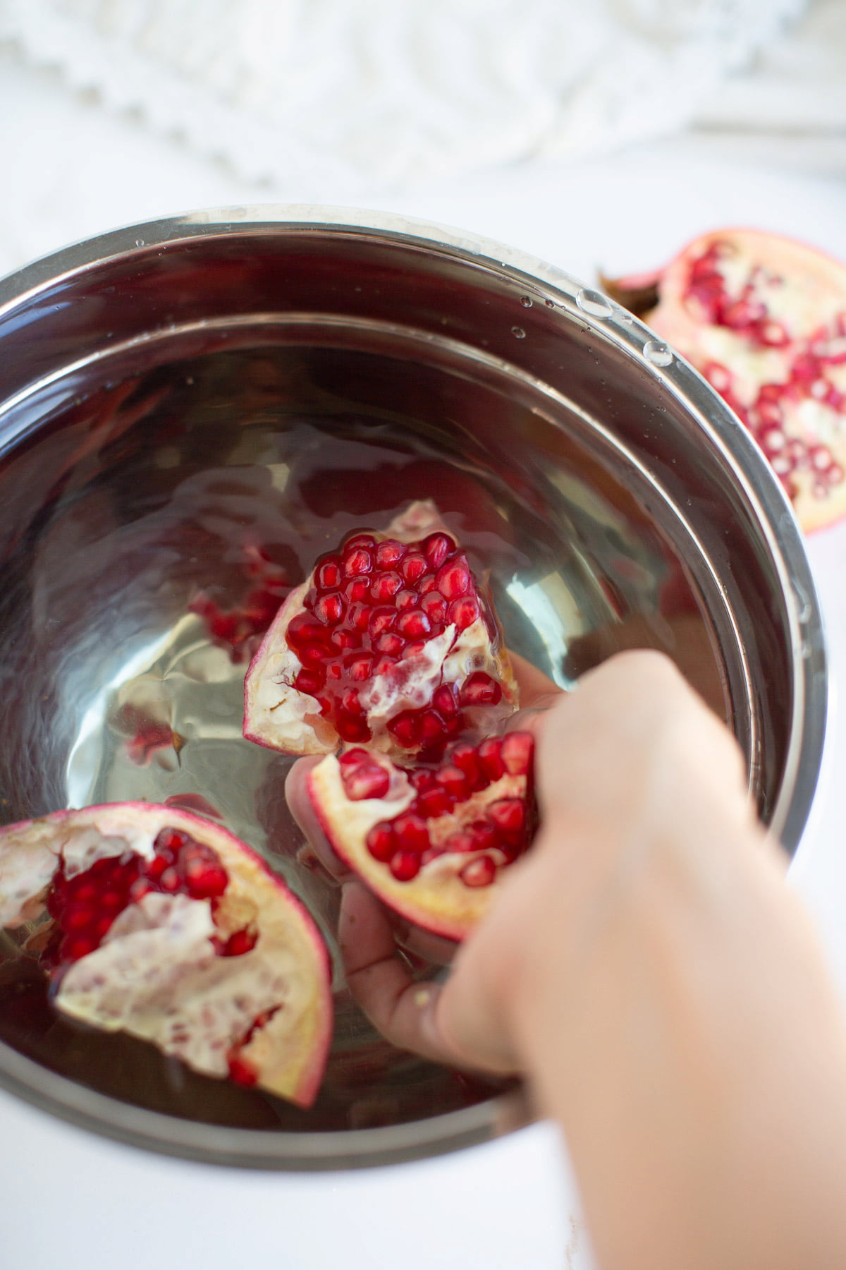 Deseeding a pomegranate.