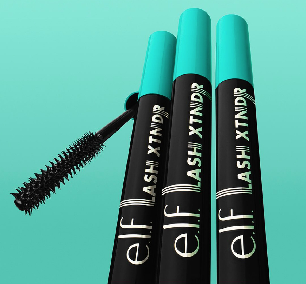 Three black ELF mascaras with turquoise lids on a turquoise background next to a black mascara wand. 