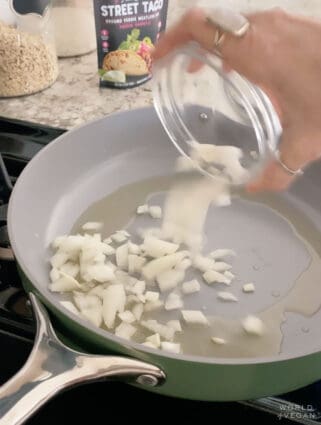 Sauteeing onions in a pan.