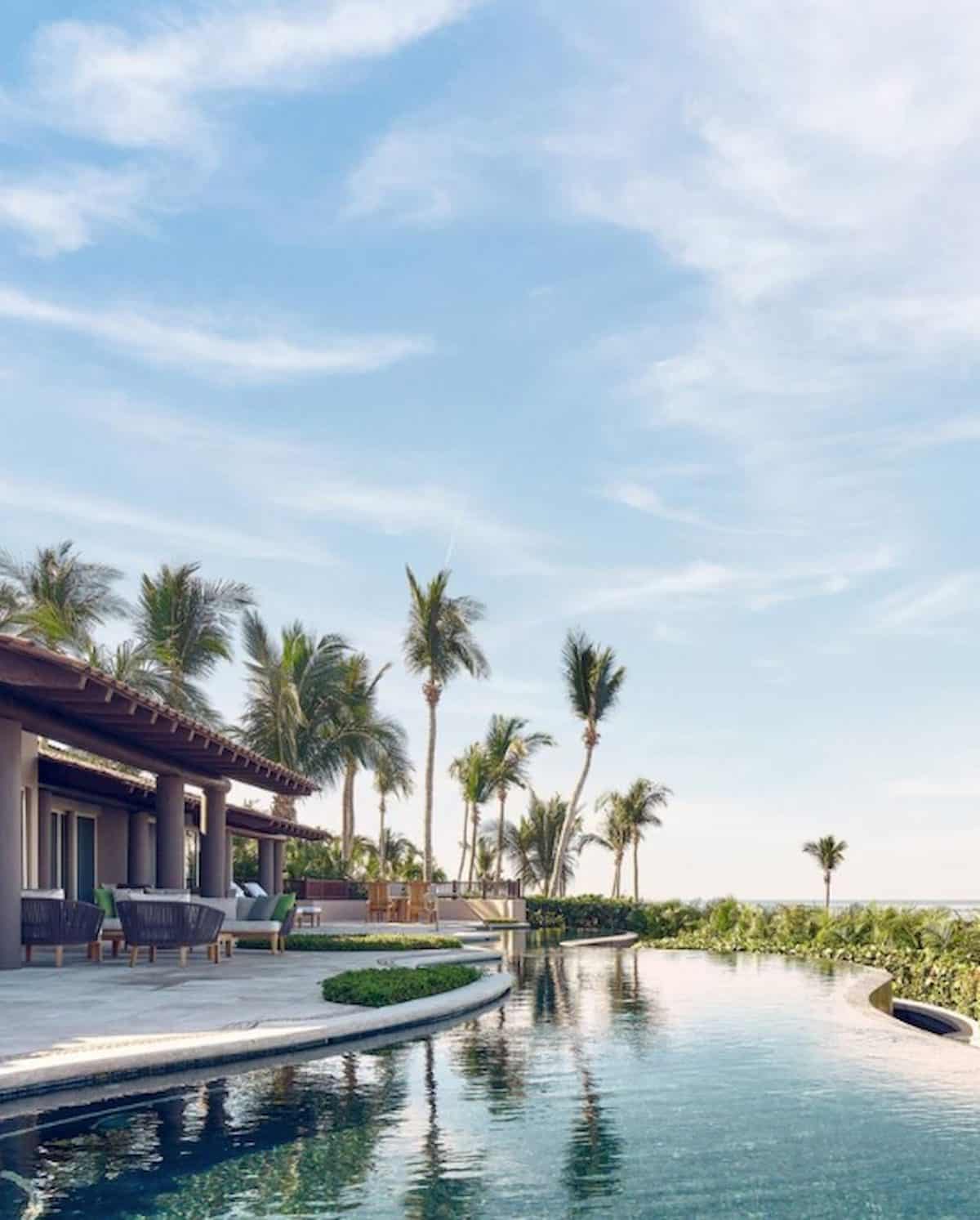 Pool and palm trees at Four Seasons Punta Mia.