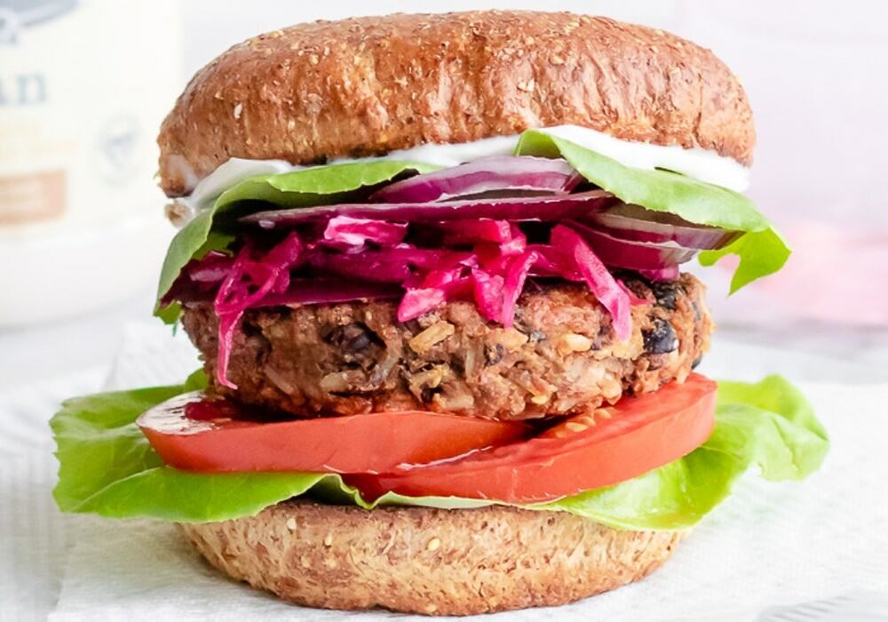 Homemade Vegan Bean and Rice Burgers for a Barbecue Served on a Whole Wheat Bun 