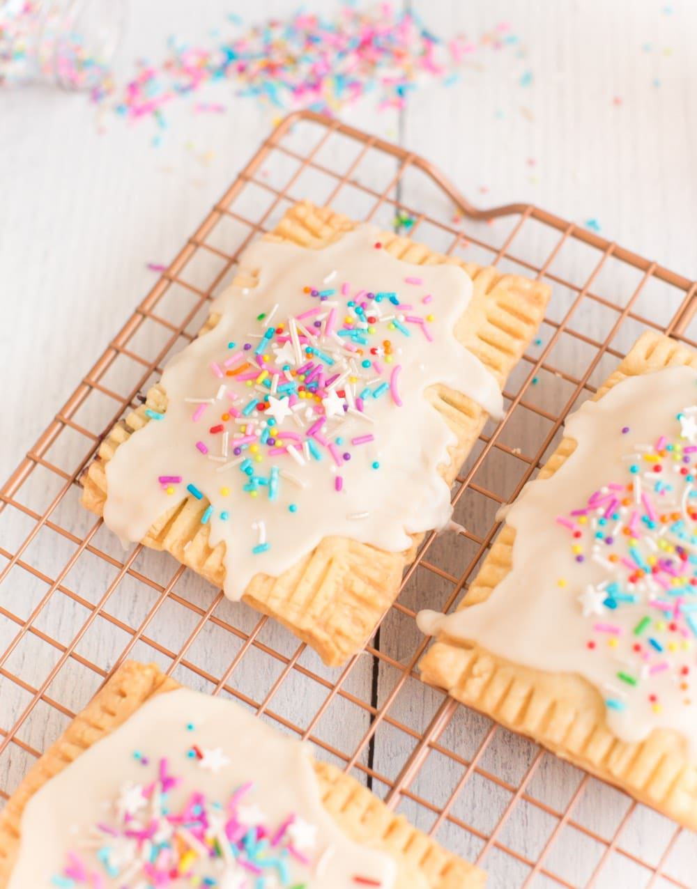 homemade vegan strawberry frosted pop tarts with rainbow sprinkles