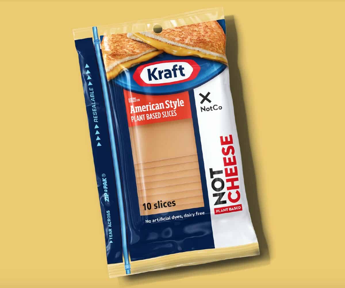 A blue and white package of Kraft Heinz Not Co American Style Plant-Based Slices on an orange background. 