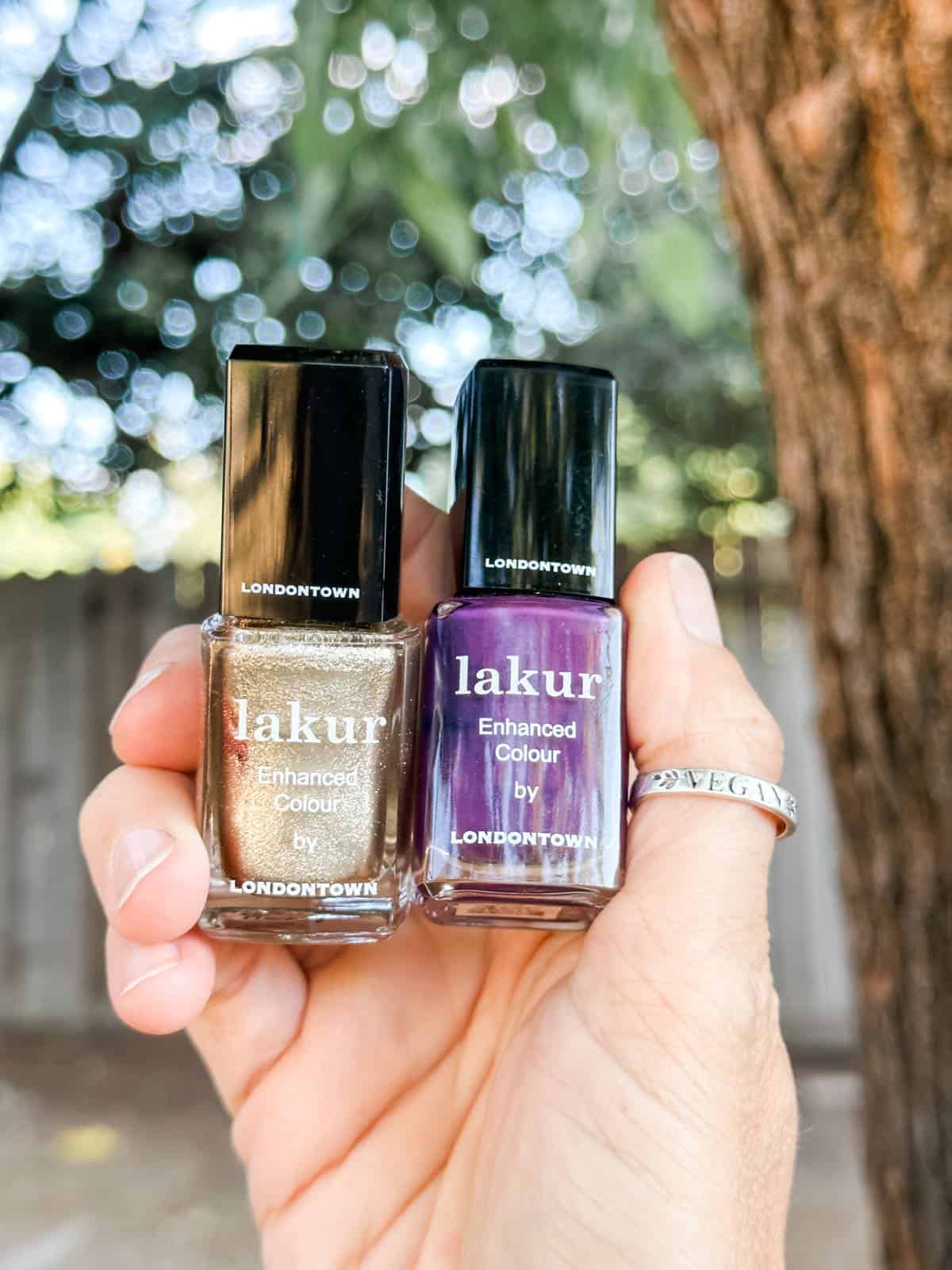 Purple and gold lakur nail polishes. 