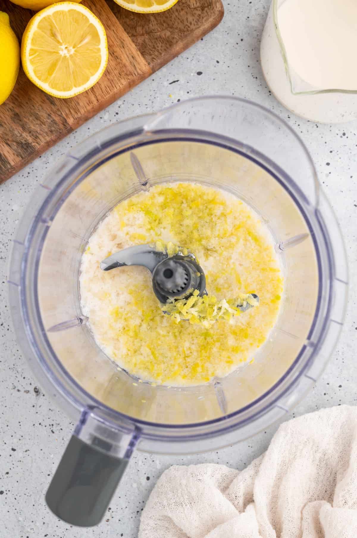 Liquid ingredients for this lemon smoothie in a blender.
