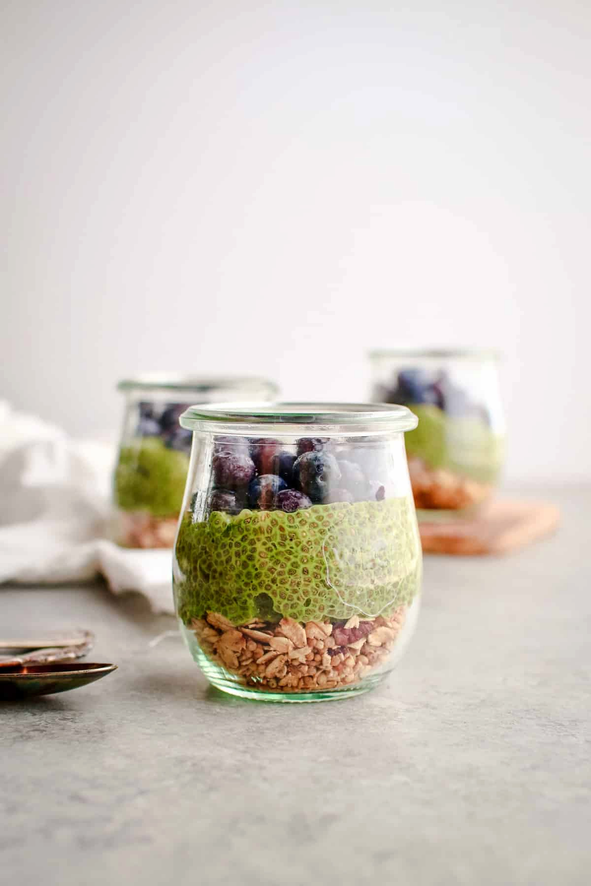 Matcha chia pudding in a glass jar.