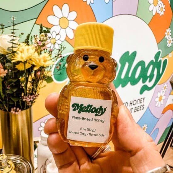 A small bottle of bear-shaped plant-based honey from Mellody Foods.