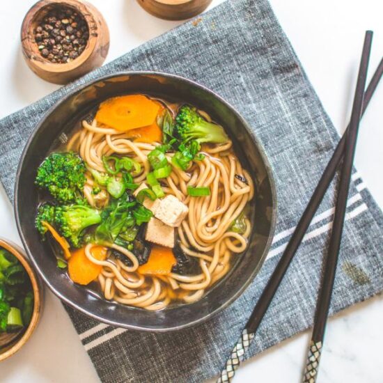 Miso Noodle Soup Bowl with Chop Sticks, Salt and Pepper on the Side