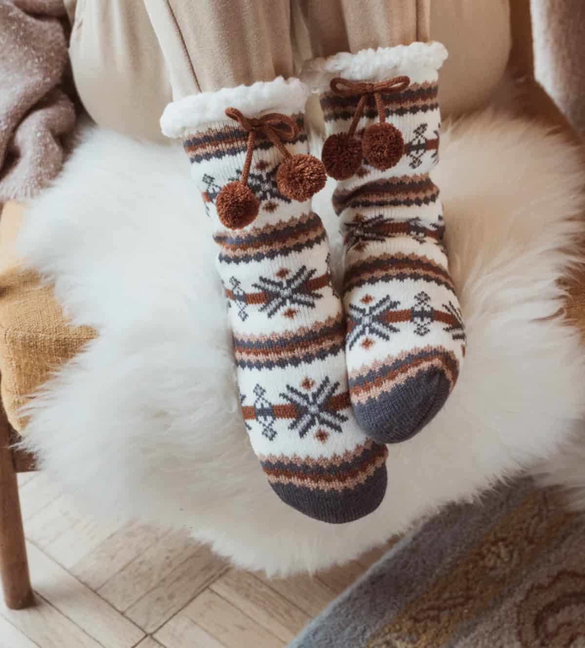 MukLuks vegan cozy faux fur knit cabin socks.