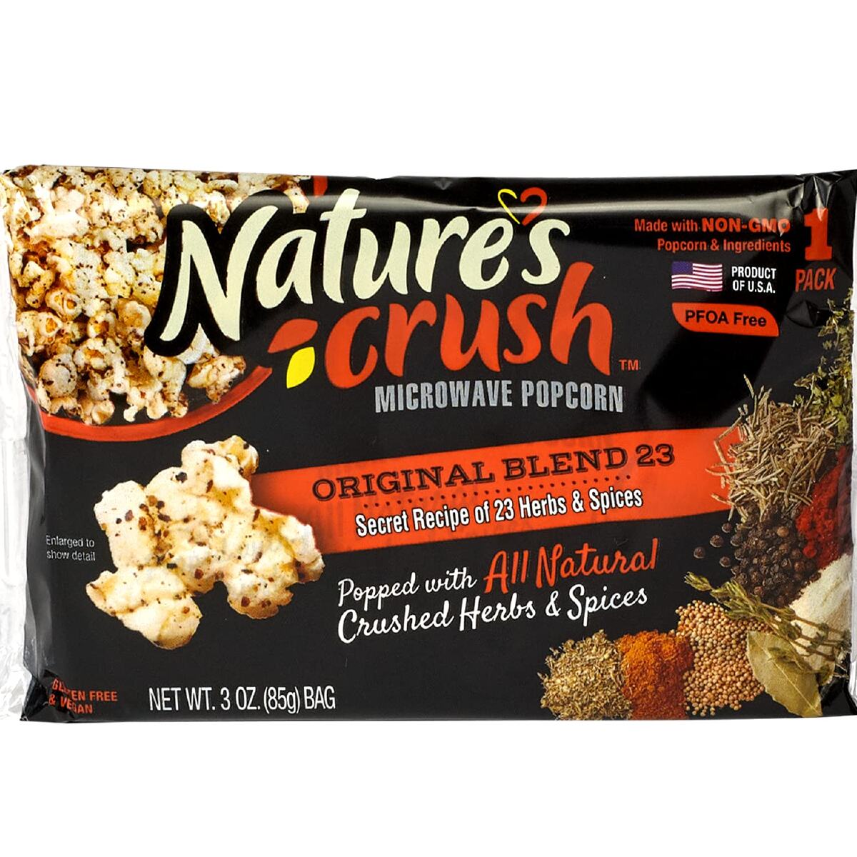 A black and red bag of Nature's Crush vegan microwave popcorn against a white background. 