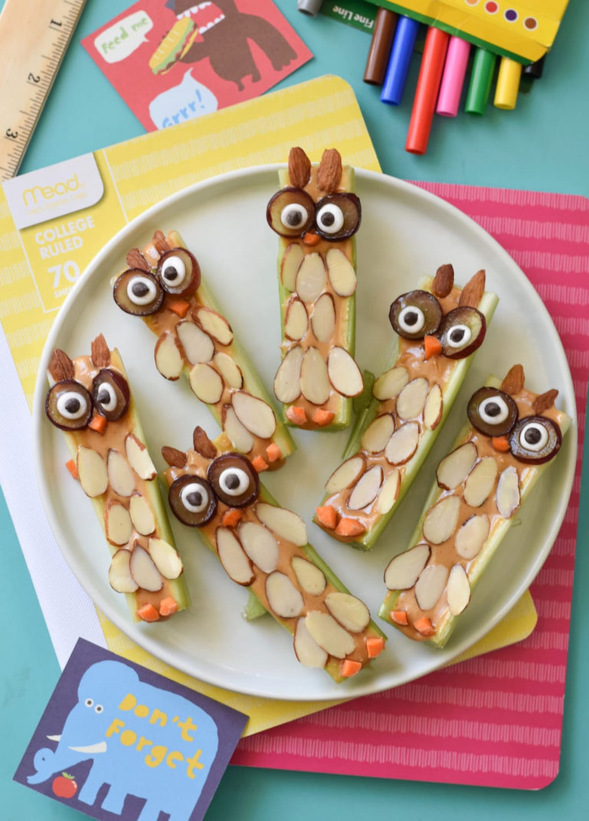 Peanut butter celery owls on a plate.