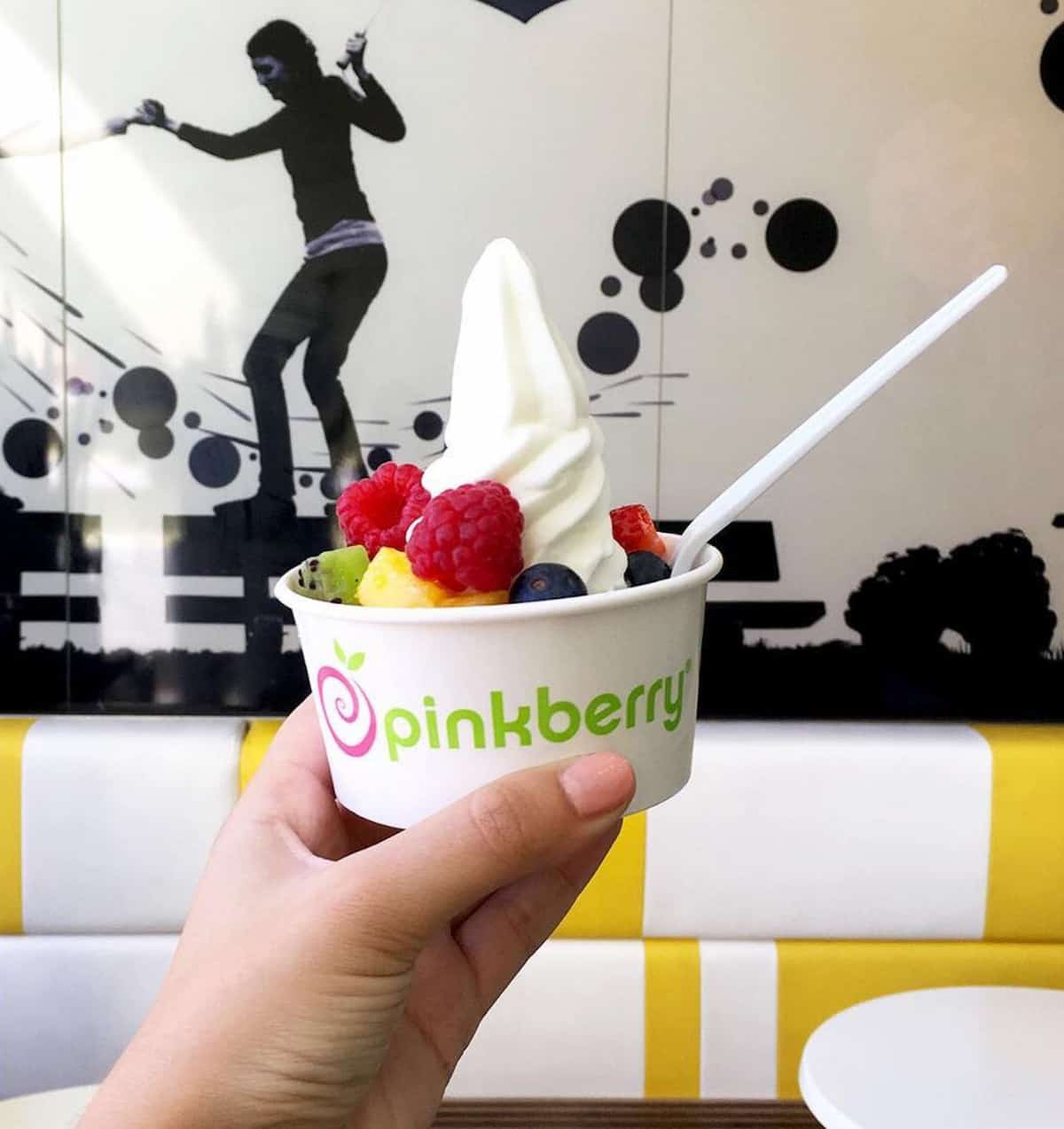 A cup of Pinkberry vegan coconut milk frozen dessert.