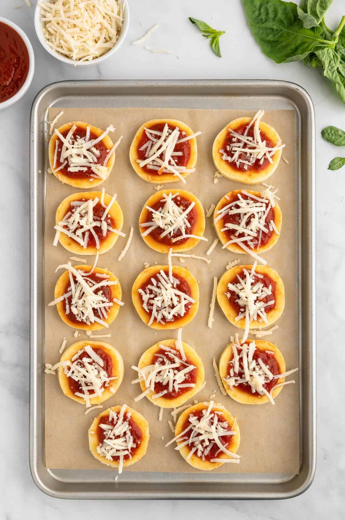 Polenta pizza bites, with vegan shreds.