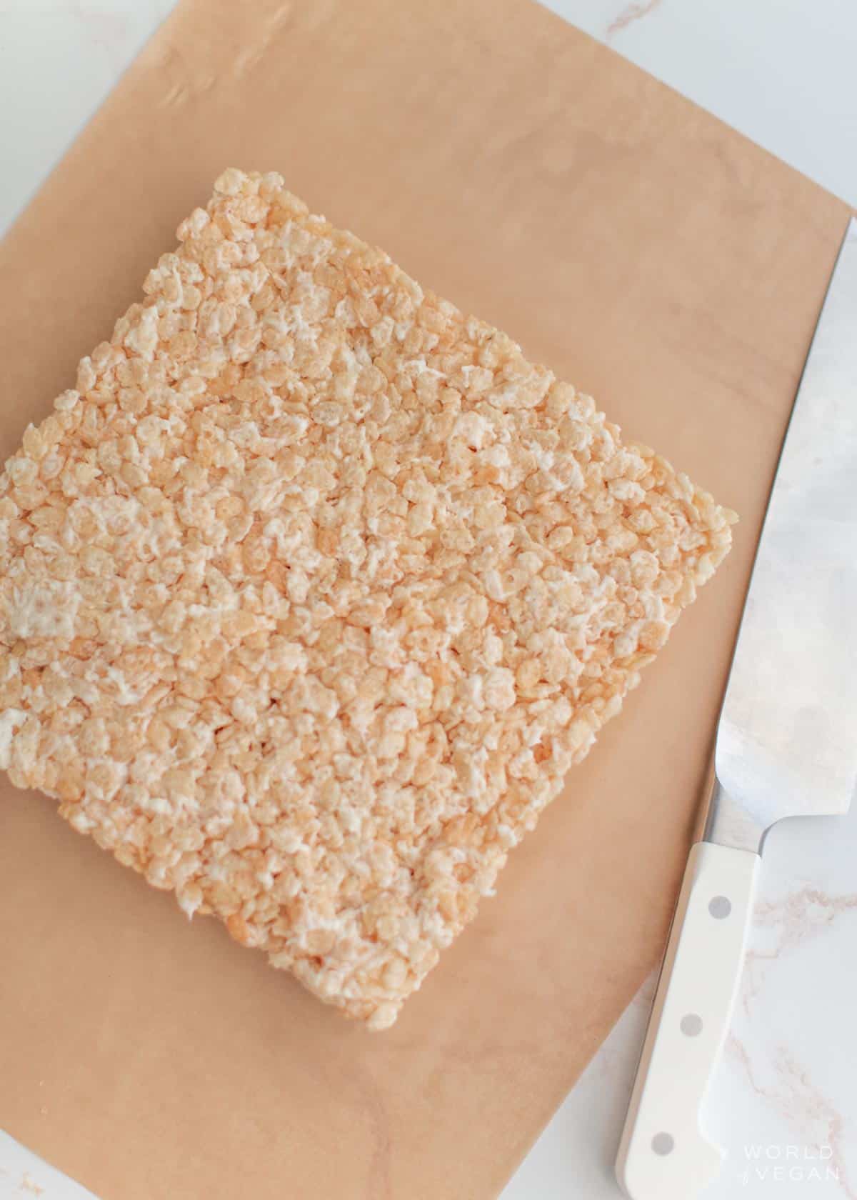 cut rice krispies into squares or rectangles with sharp chefs knife