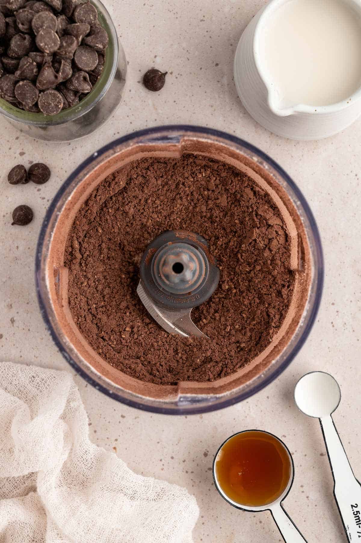 Cocoa powder blended into the oat flour in a food processor.