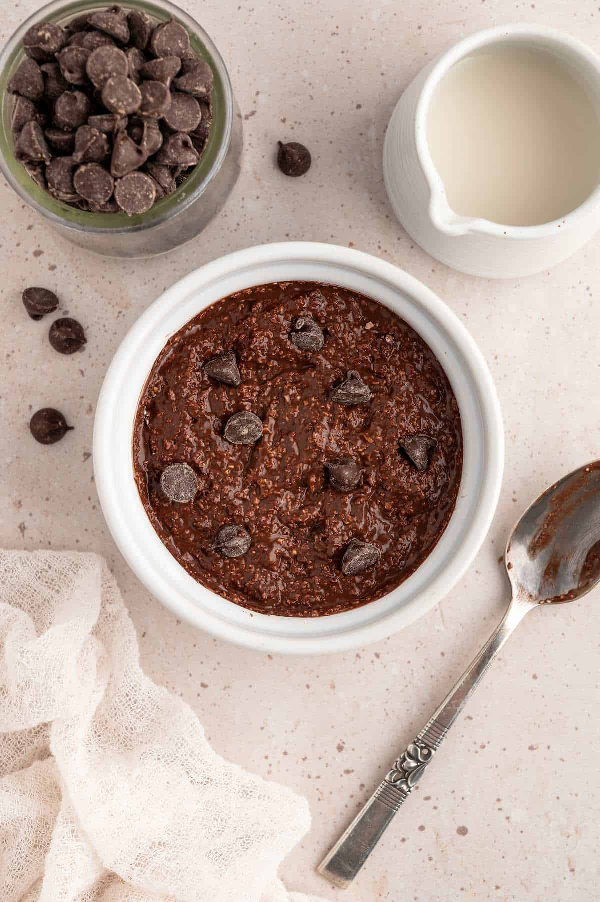 Protein mug caked batter in a ramekin topped with chocolate chips.