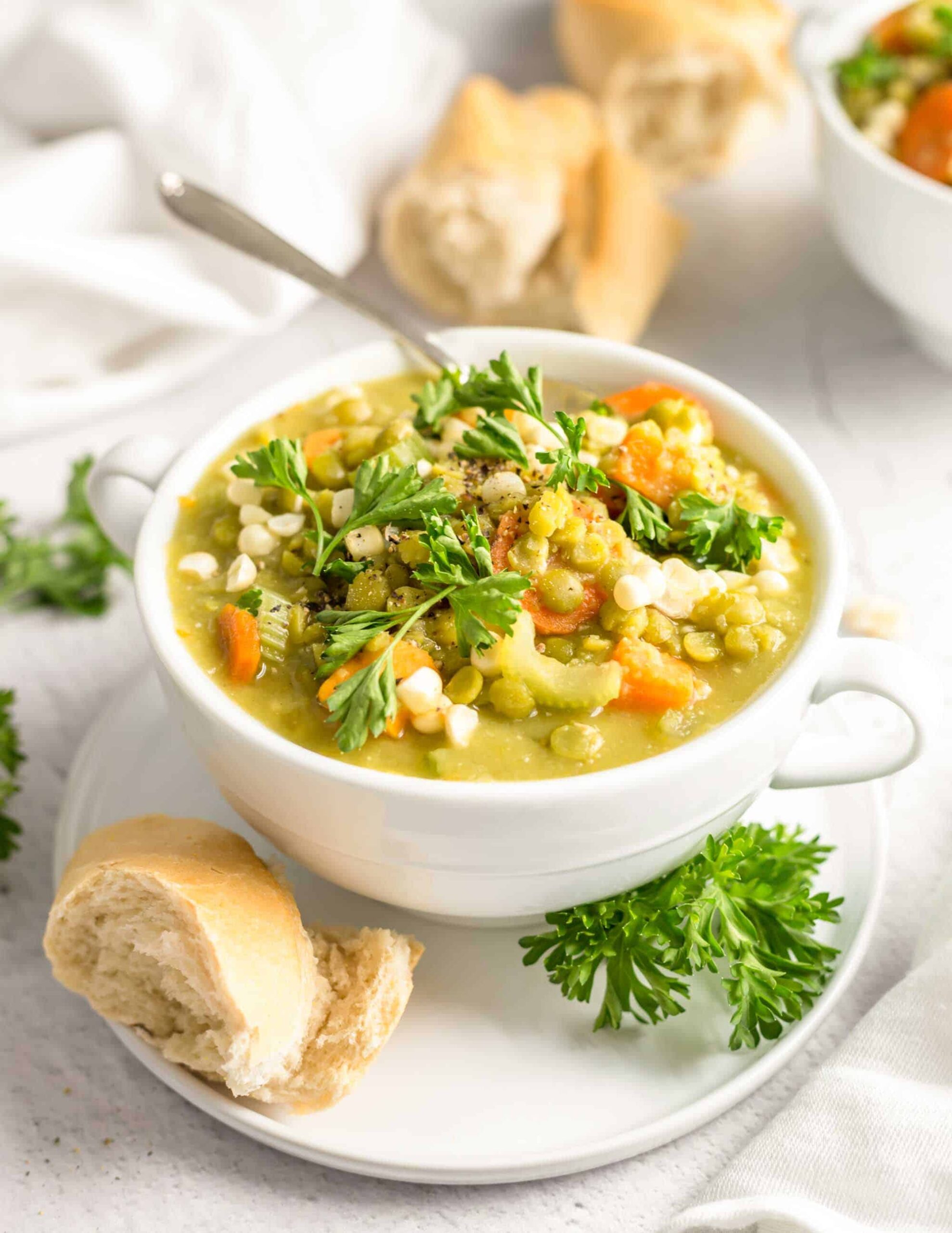 Plant Based Split Pea and Sweet Potato Stew Recipe Sserved in a Bowl With a Side of Rustic Bread