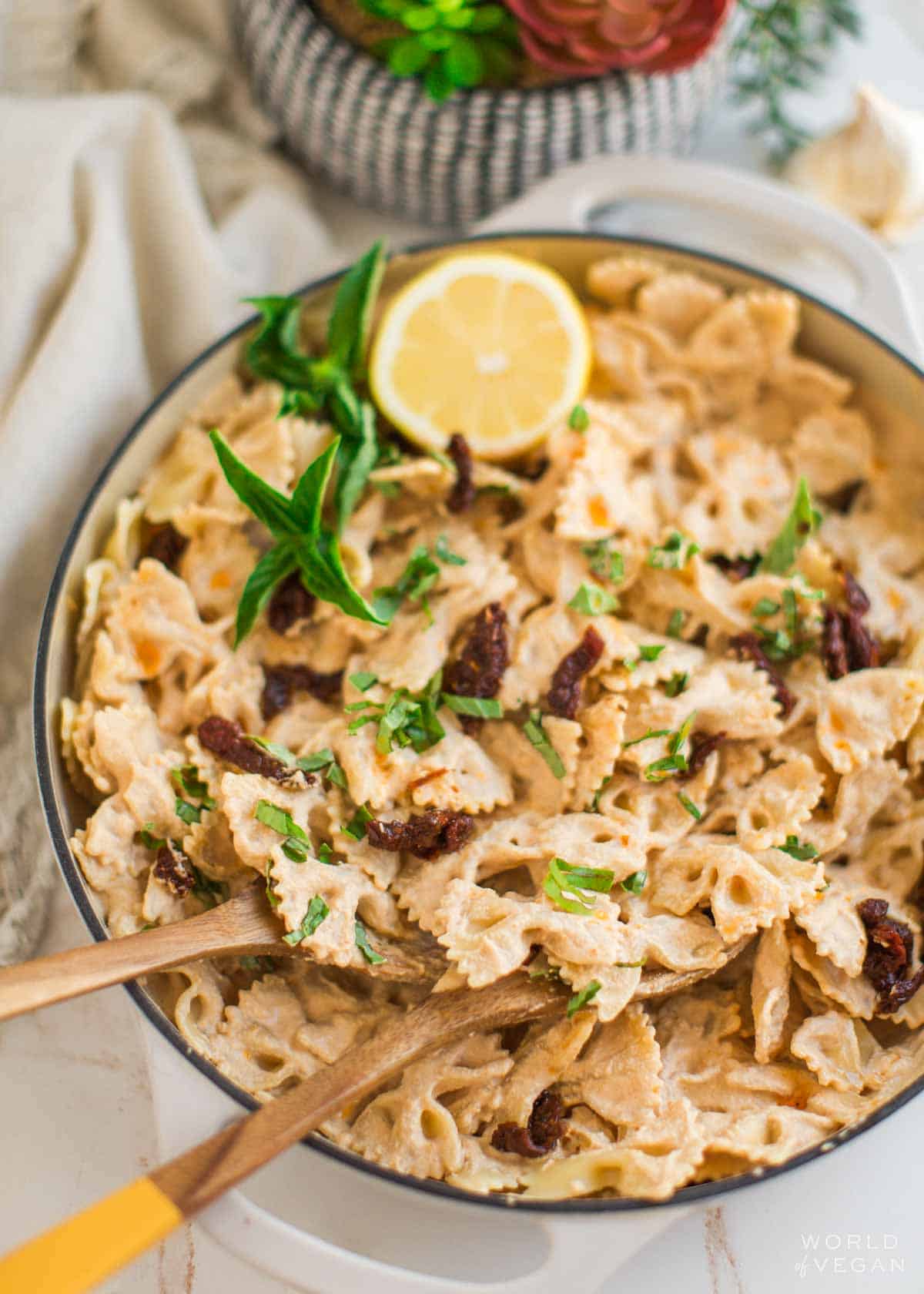 Sun dried tomato sauce pasta in a pan.