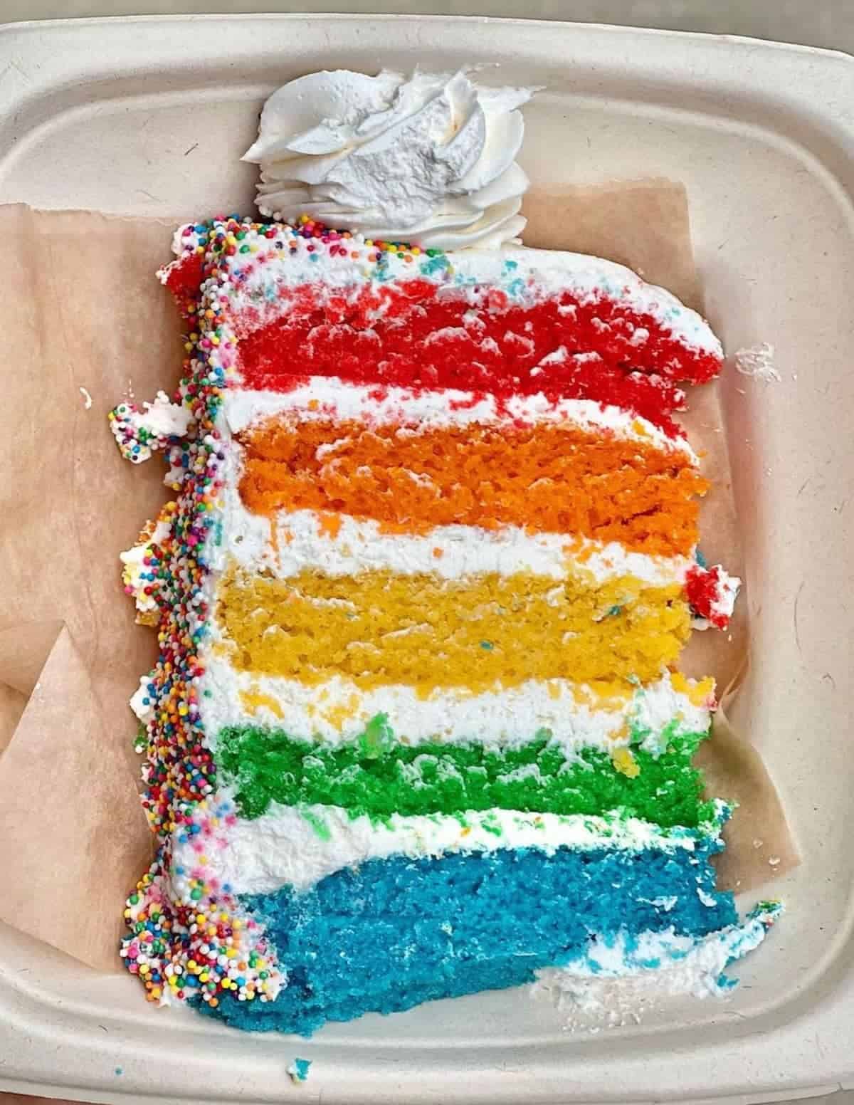 A slice of Rainbow Cake at Sweet Vegan Bakes in Chicago.