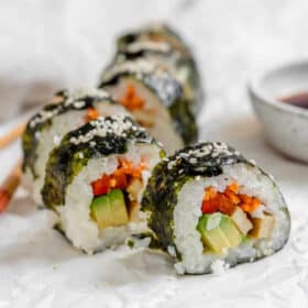 Tofu sushi rolls arranged on a plate.