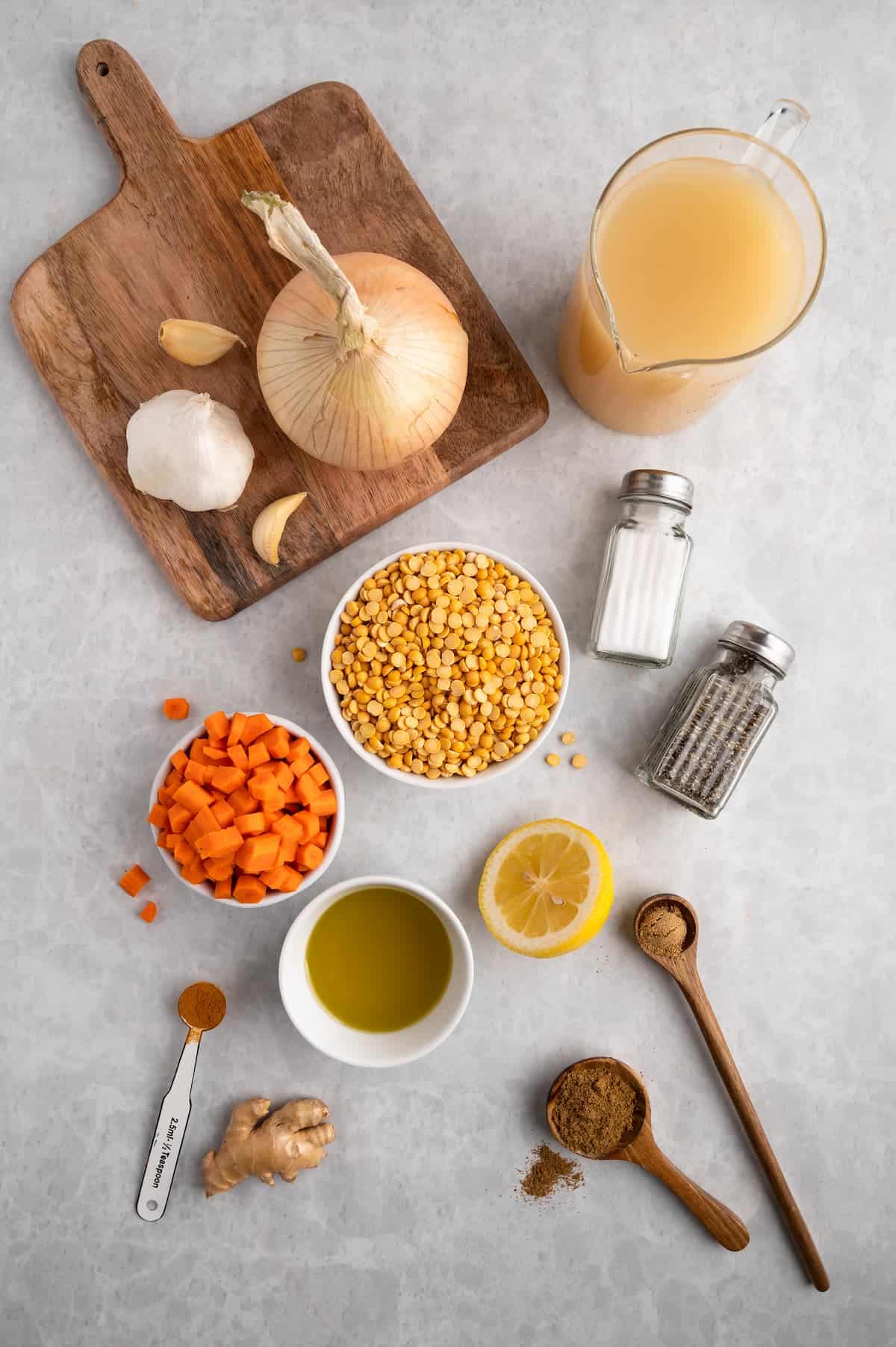 Ingredients for toor dal, shot top-down against a white background.