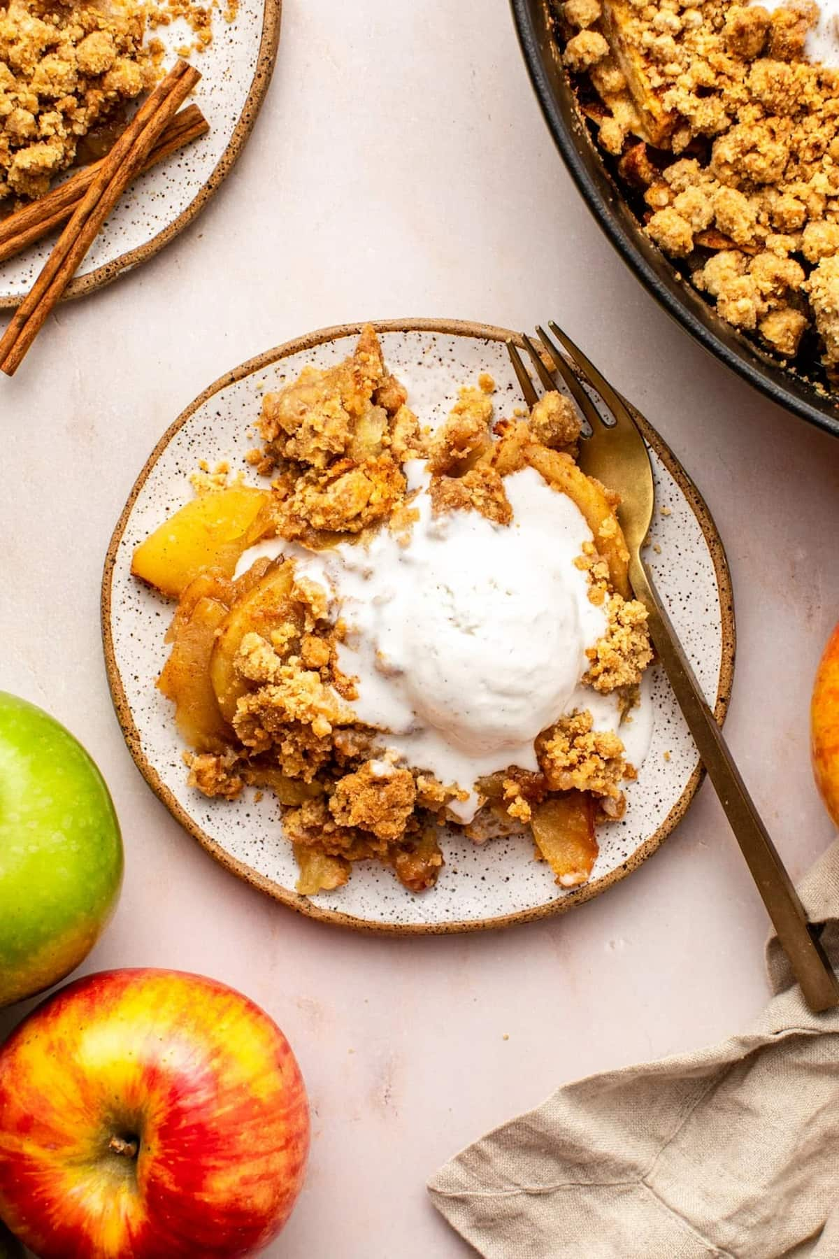 A vegan apple crisp with ice cream.