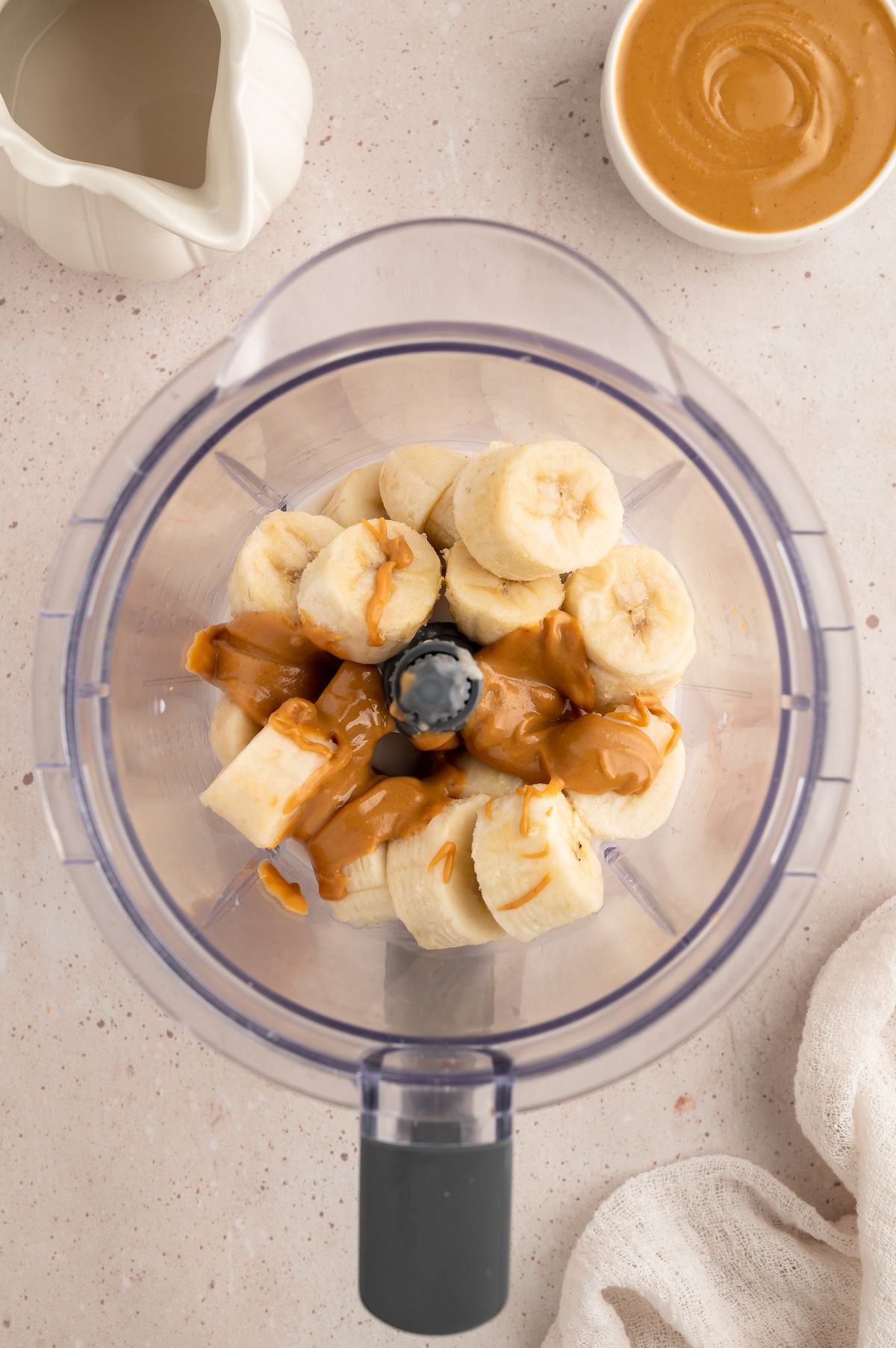 Ingredients for vegan milkshake in a blender.