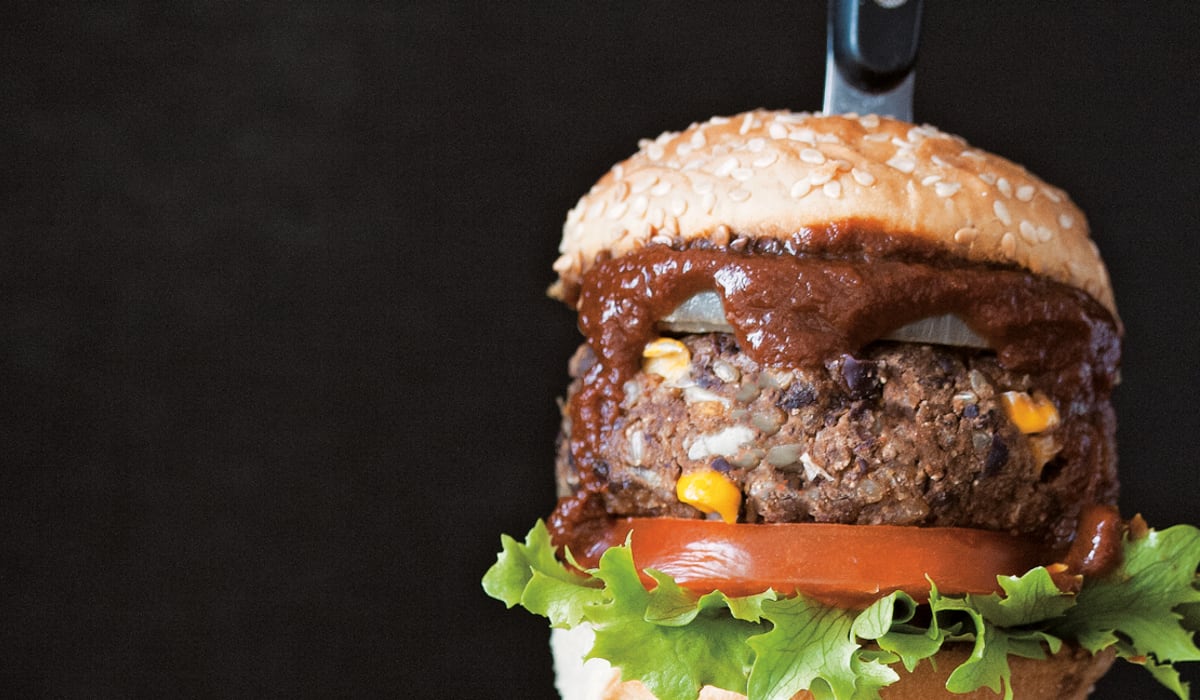 Vegan black bean burger with barbecue sauce.