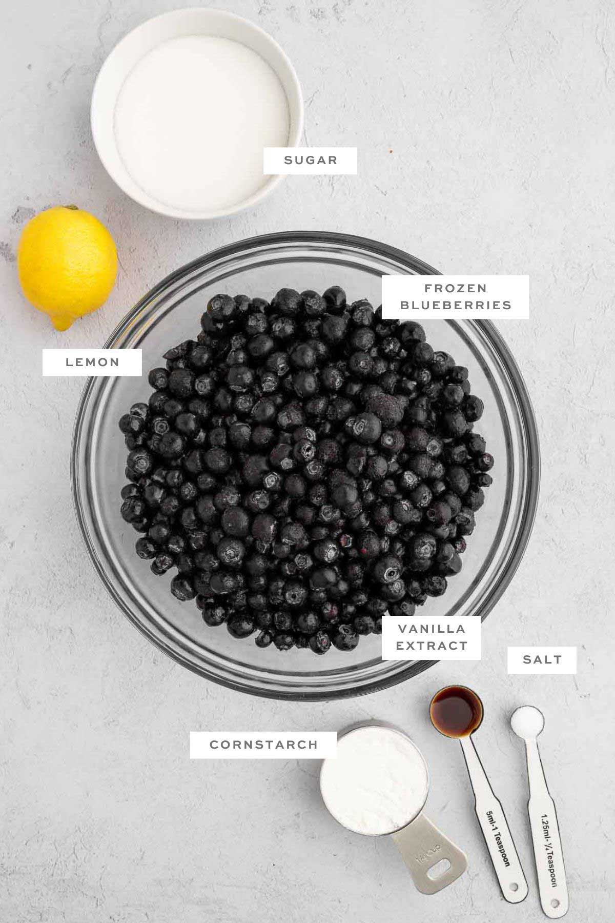 Key ingredients for a vegan blueberry pie with labels.