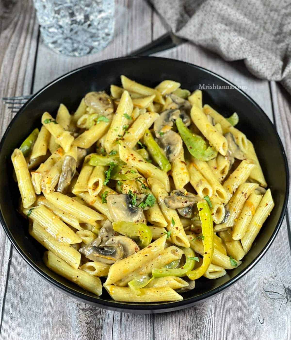 A bowl of vegan cajun pasta.