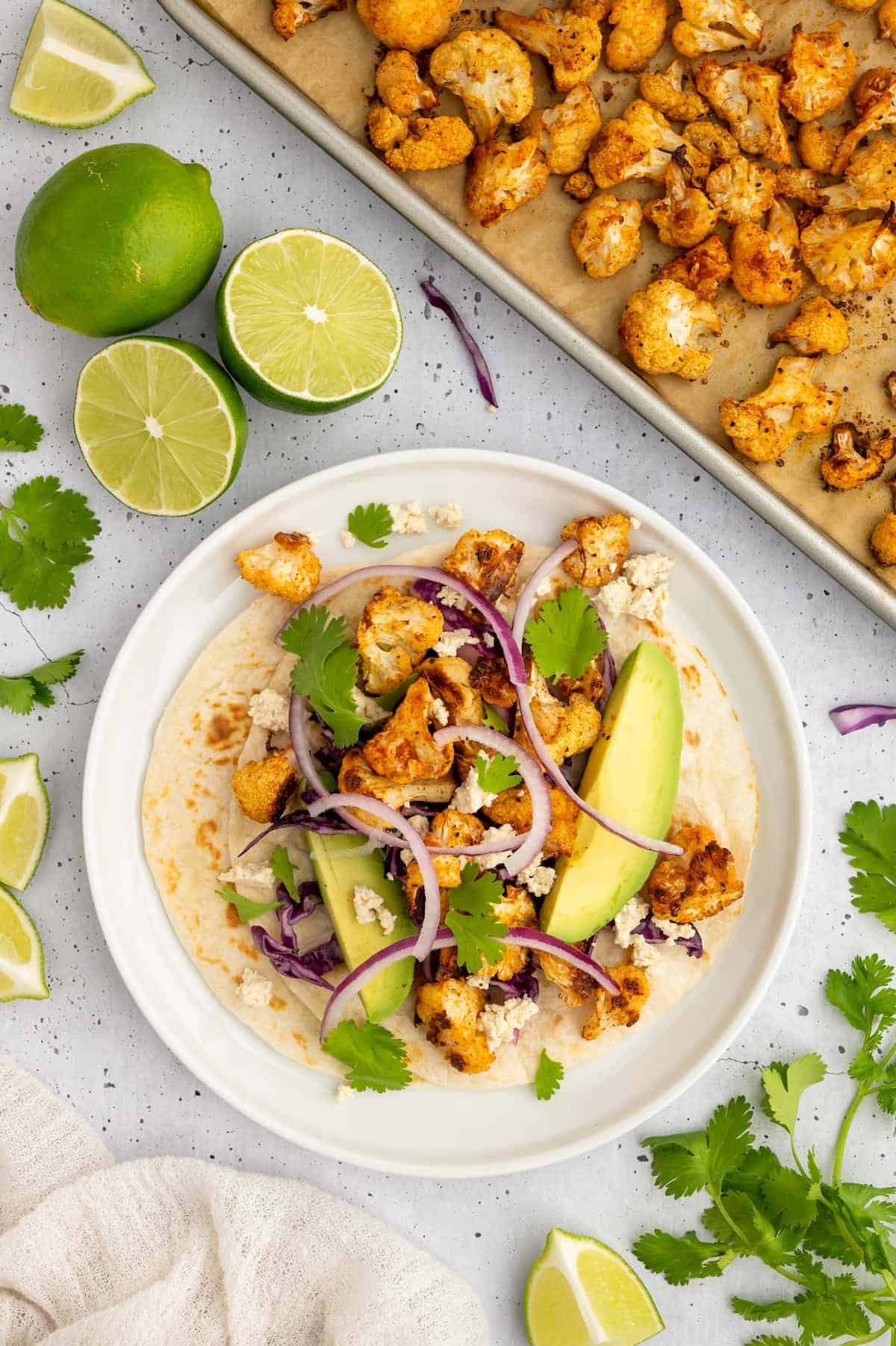 A vegan cauliflower taco, assembled and garnished.