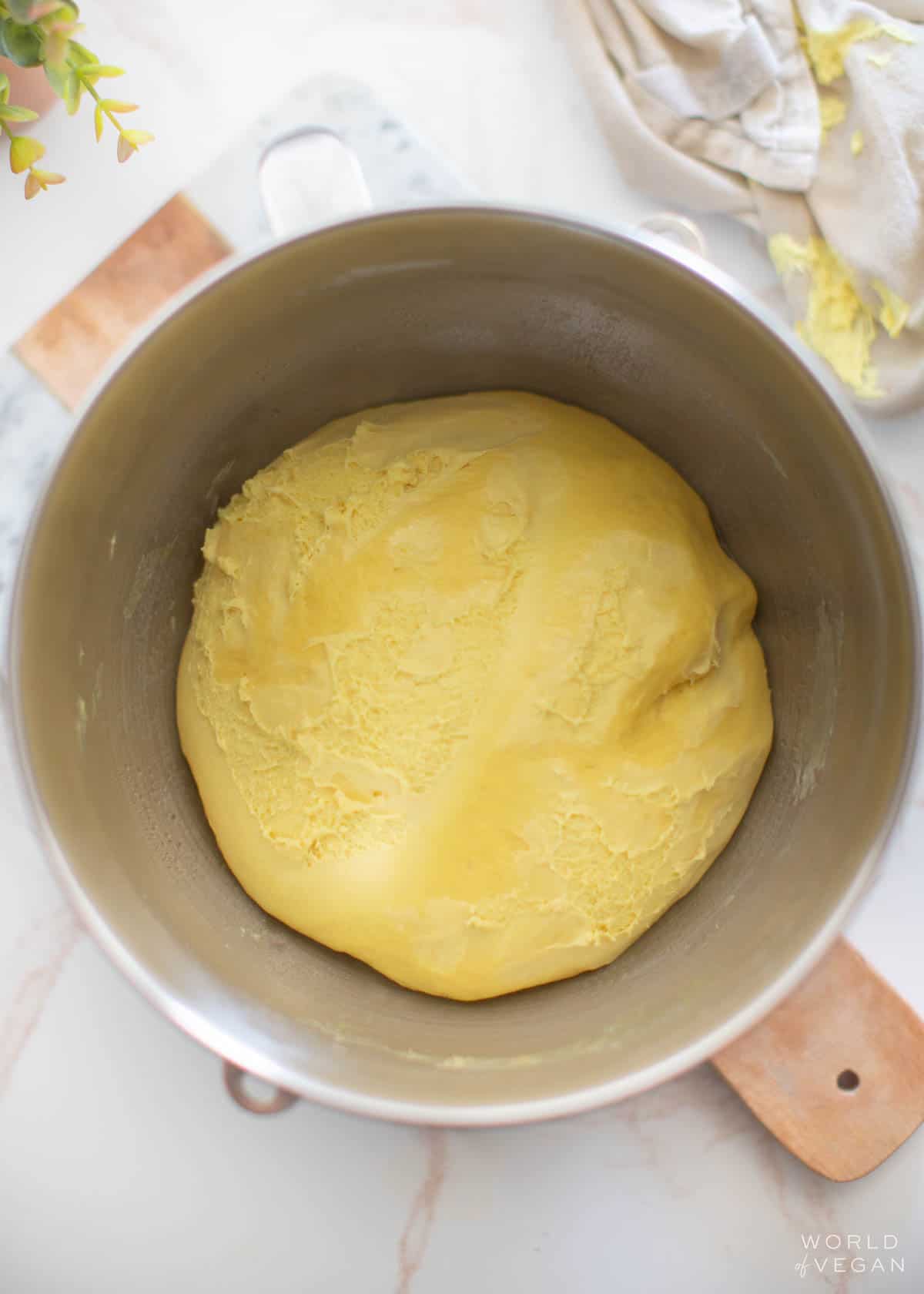 Vegan challah dough placed in a greased bowl to rise.