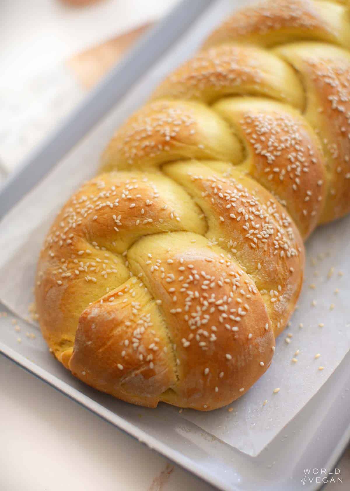 Braided vegan challah bread after baking.