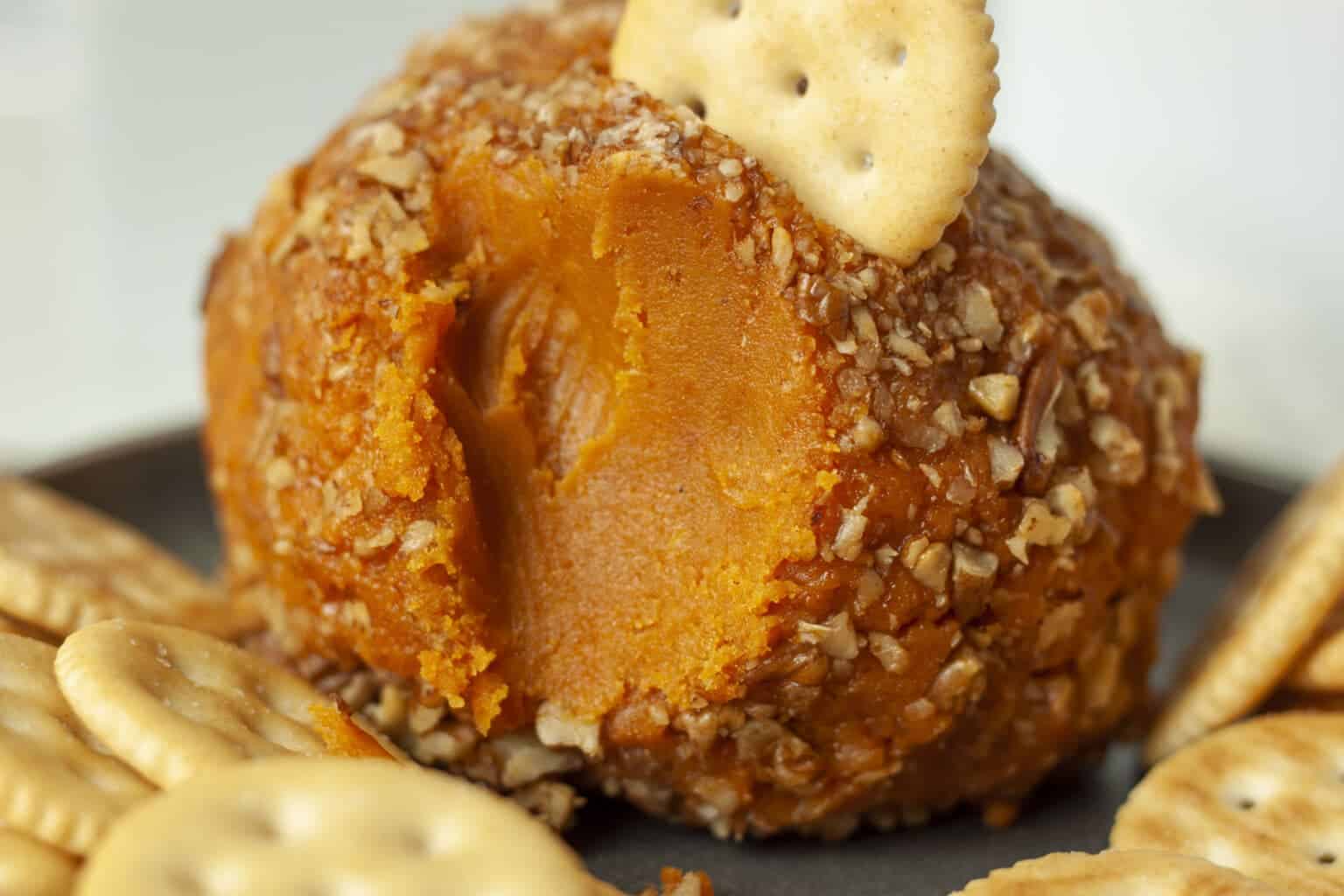 vegan cheddar cheese ball with crackers