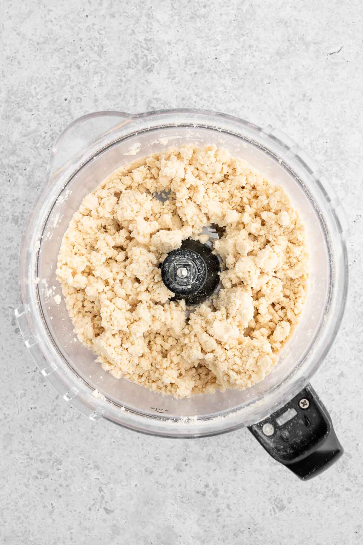 The crust dough mixed in a food processor.