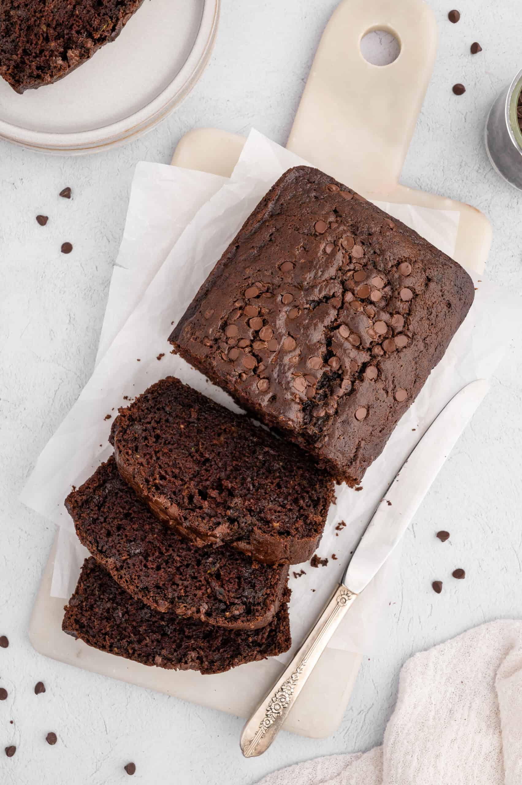 A sliced loaf of vegan chocolate zucchini bread.