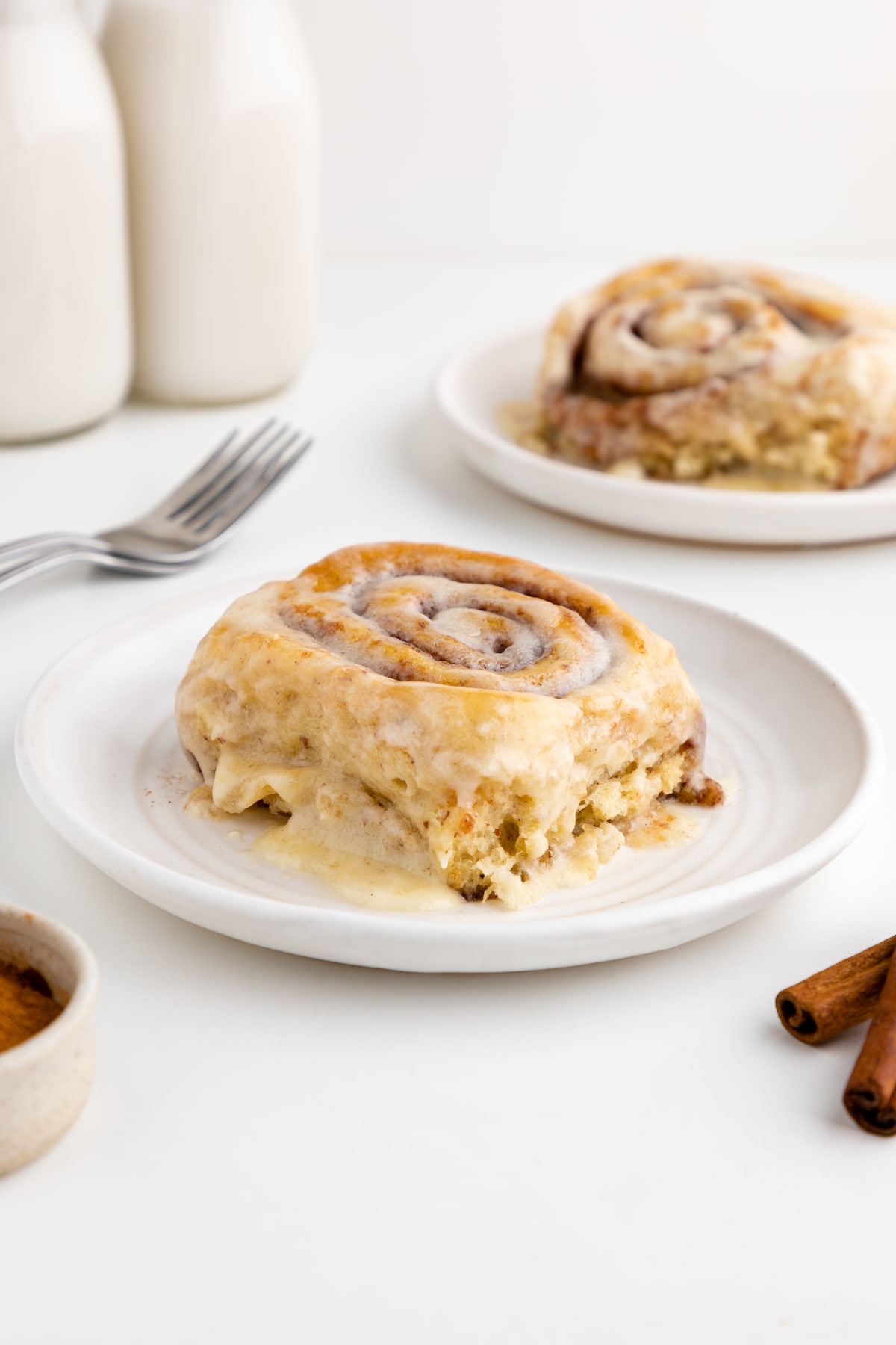 Vegan cinnamon roll served on a plate.