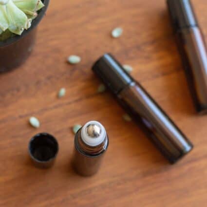 DIY perfume in a roller bottle with the cap off.
